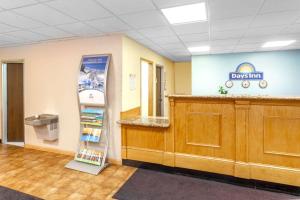 a waiting room at a dental office with a cash register at Days Inn by Wyndham Portage in Portage