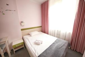 Postel nebo postele na pokoji v ubytování eMKa Hostel