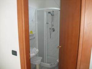 a bathroom with a shower and a toilet at Hotel Adriana in Laigueglia +33 photos