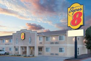 a hotel with a sign in front of it at Super 8 by Wyndham Bloomfield in Bloomfield