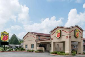 a fast food restaurant with a building at Super 8 by Wyndham Guelph in Guelph