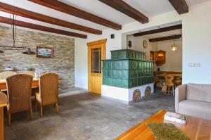 a living room with a table and a fireplace at Landhaus Danita in Bodensdorf