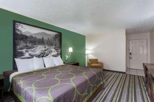 Postel nebo postele na pokoji v ubytování Syracuse Inn