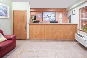 a waiting room at a hospital with a waiting counter at Super 8 by Wyndham Chickasha in Chickasha