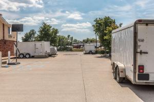 a couple of trailers parked in a parking lot at Super 8 by Wyndham Potosi in Potosi