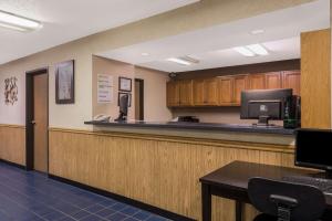 a waiting room with a cash register at Super 8 by Wyndham Potosi in Potosi