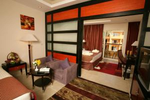 A bed or beds in a room at Rehana Royal Beach Resort - Aquapark & Spa - Family & Couples Only - Premium Ultra All-Inclusive 24H