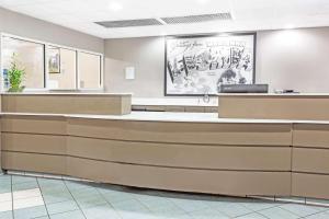 a lobby of a waiting room with a reception counter at Super 8 by Wyndham Marianna in Marianna