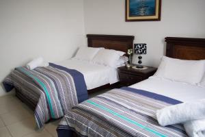Ліжко або ліжка в номері Hotel Valeritos