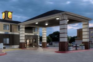 a building with a clock tower on top of it at Super 8 by Wyndham Victoria/North/Mall Area in Victoria