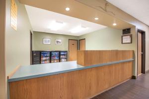 a waiting room with a counter and a cash register at Four Seasons Inn in Bottineau