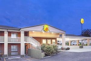 a fast food building with a sign on it at Super 8 by Wyndham Salina/Scenic Hills Area in Salina