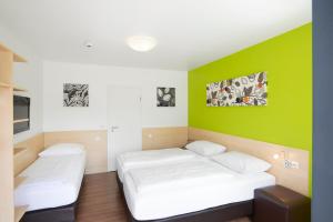 Postel nebo postele na pokoji v ubytování City Motel Soest