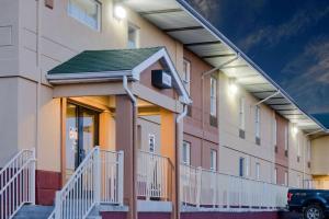 a building with a parking lot in front of it at Super 8 by Wyndham Allentown in Allentown