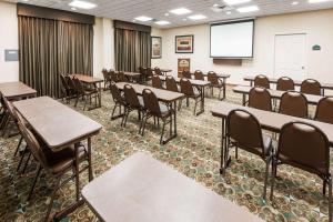 a classroom with tables and chairs and a screen at Wingate by Wyndham New Braunfels in New Braunfels +24 photos