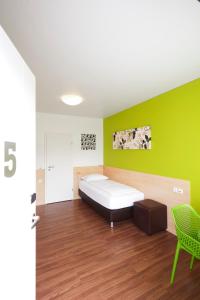 Postel nebo postele na pokoji v ubytování City Motel Soest
