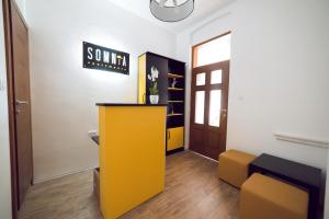 a room with a yellow counter and a door at Somnia in Bitola