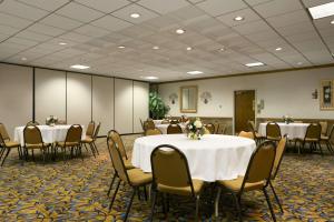 a conference room with tables and chairs with white table cloth at Days Inn by Wyndham Sidney OH in Sidney
