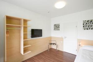 TV a/nebo společenská místnost v ubytování City Motel Soest