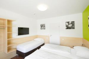Postel nebo postele na pokoji v ubytování City Motel Soest