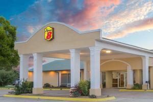 a fast food restaurant with a mcdonalds sign on it at Super 8 by Wyndham Brinkley in Brinkley