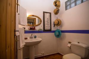 a bathroom with a sink and a toilet and a mirror at Dreaming House in Nea Vrasna +52 photos