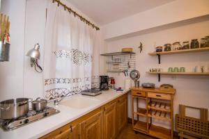 a kitchen with a sink and a counter at Dreaming House in Nea Vrasna