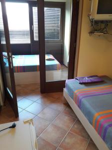 Postel nebo postele na pokoji v ubytování Hotel Pelikan