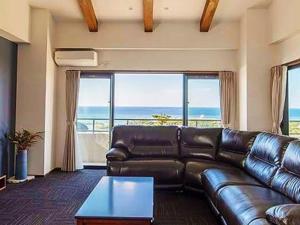 Posezení v ubytování Hotel Condominium DOKADOKA ホテルコンドミニアム土花土花