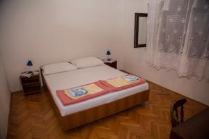 Postel nebo postele na pokoji v ubytování Apartman Marijana Smojver