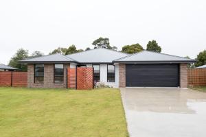 a house with a garage at Euphoria House in Wynyard