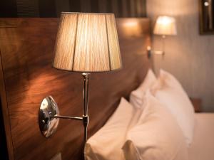 Postel nebo postele na pokoji v ubytování Palace Hotel