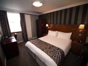 Postel nebo postele na pokoji v ubytování Palace Hotel