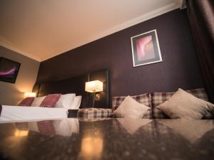 Postel nebo postele na pokoji v ubytování Palace Hotel