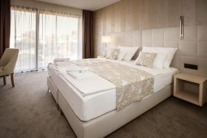 Postel nebo postele na pokoji v ubytování Hotel Maritime