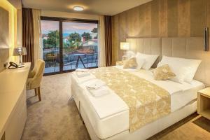 Postel nebo postele na pokoji v ubytování Hotel Maritime