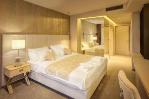 Postel nebo postele na pokoji v ubytování Hotel Maritime