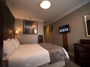 Postel nebo postele na pokoji v ubytování Palace Hotel