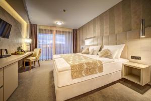 Postel nebo postele na pokoji v ubytování Hotel Maritime