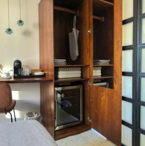 a room with a wooden cabinet and a wooden shelf at Agave Room Rental in Riomaggiore