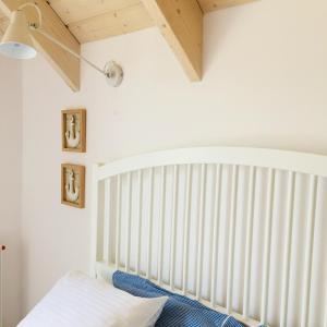 Postel nebo postele na pokoji v ubytování Zatoka Mew