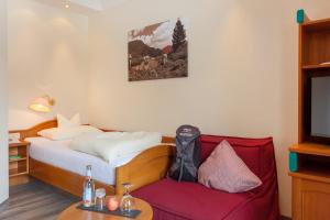 Ein Bett oder Betten in einem Zimmer der Unterkunft Family & Sporthotel Kärntnerhof