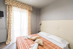 Postel nebo postele na pokoji v ubytování Umbriaverde Sporting & Resort