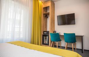 TV a/nebo společenská místnost v ubytování Hotel Bistrita
