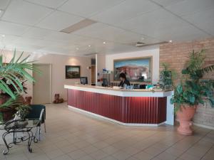 a large kitchen with a large counter top at The Lodge Motel in South Hedland