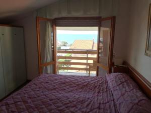 Postel nebo postele na pokoji v ubytování Hotel Michela