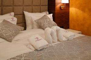 Postel nebo postele na pokoji v ubytování Hotel Passpartù Home Garni