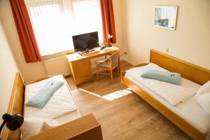 TV a/nebo společenská místnost v ubytování Hotel Janssen