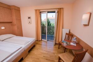 Postel nebo postele na pokoji v ubytování JUFA Hotel Fürstenfeld + 37 fotografií