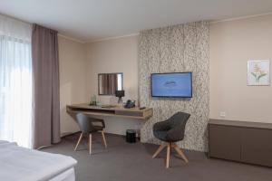 Televízia a/alebo spoločenská miestnosť v ubytovaní Hotel Panská Zahrada
